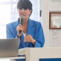 Faculty speaking to crowd